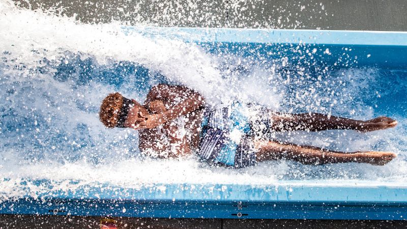 Man sliding down ride 