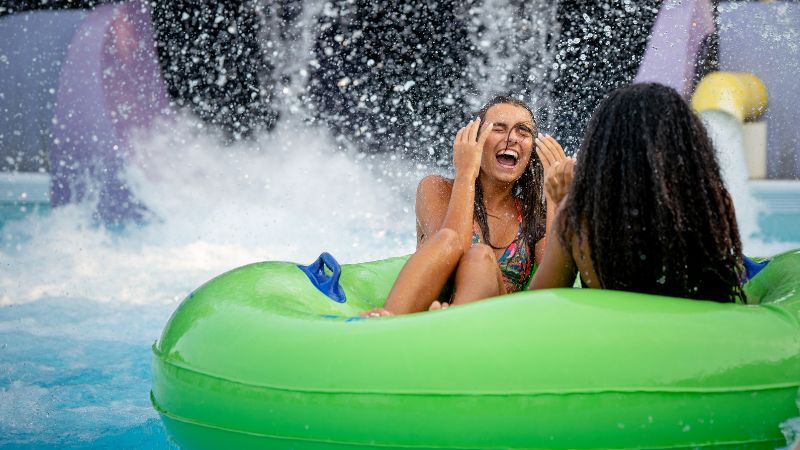 child smiling and enjoying the wave pool